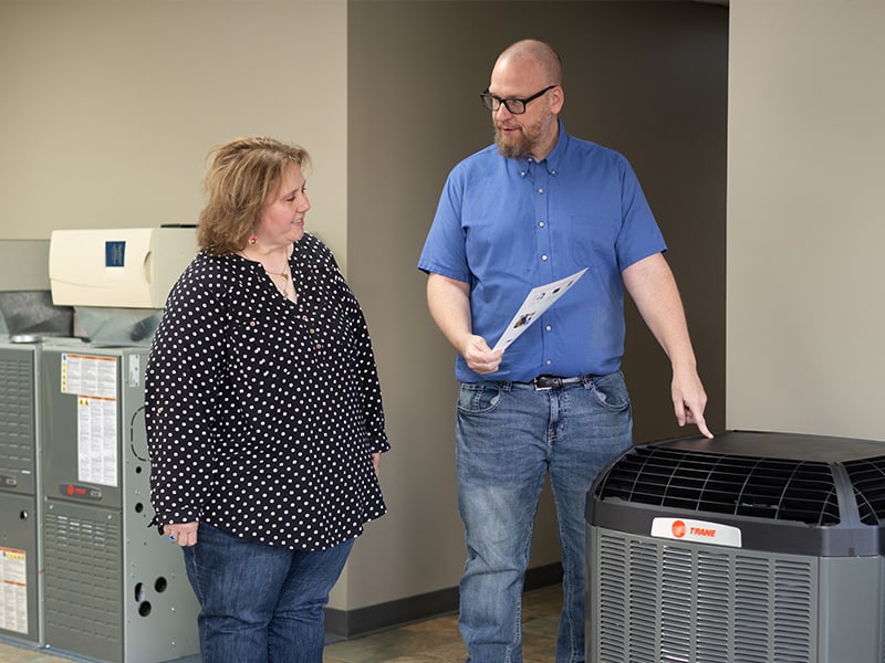 a man standing in front of a computer