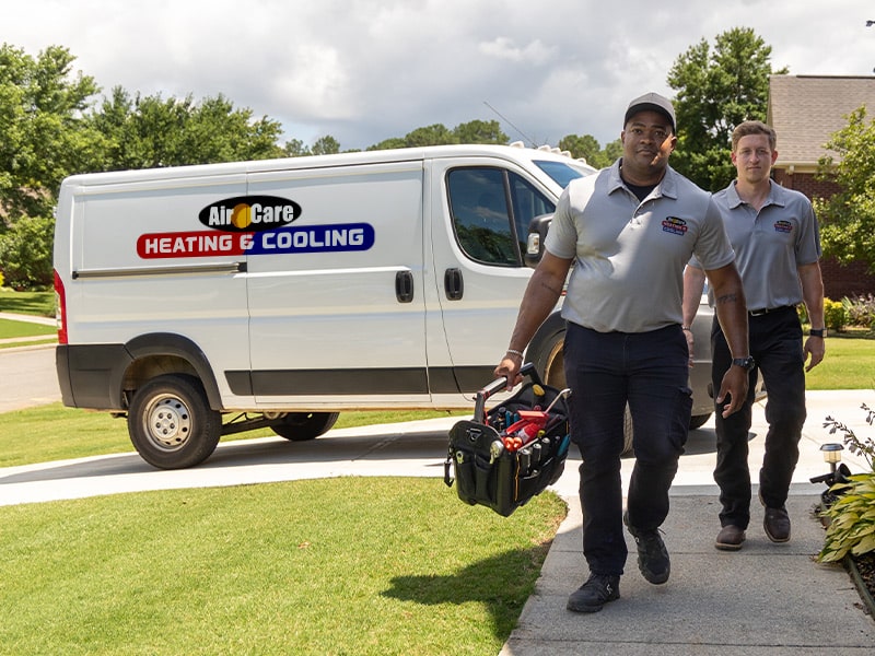 a group of people standing in front of a truck